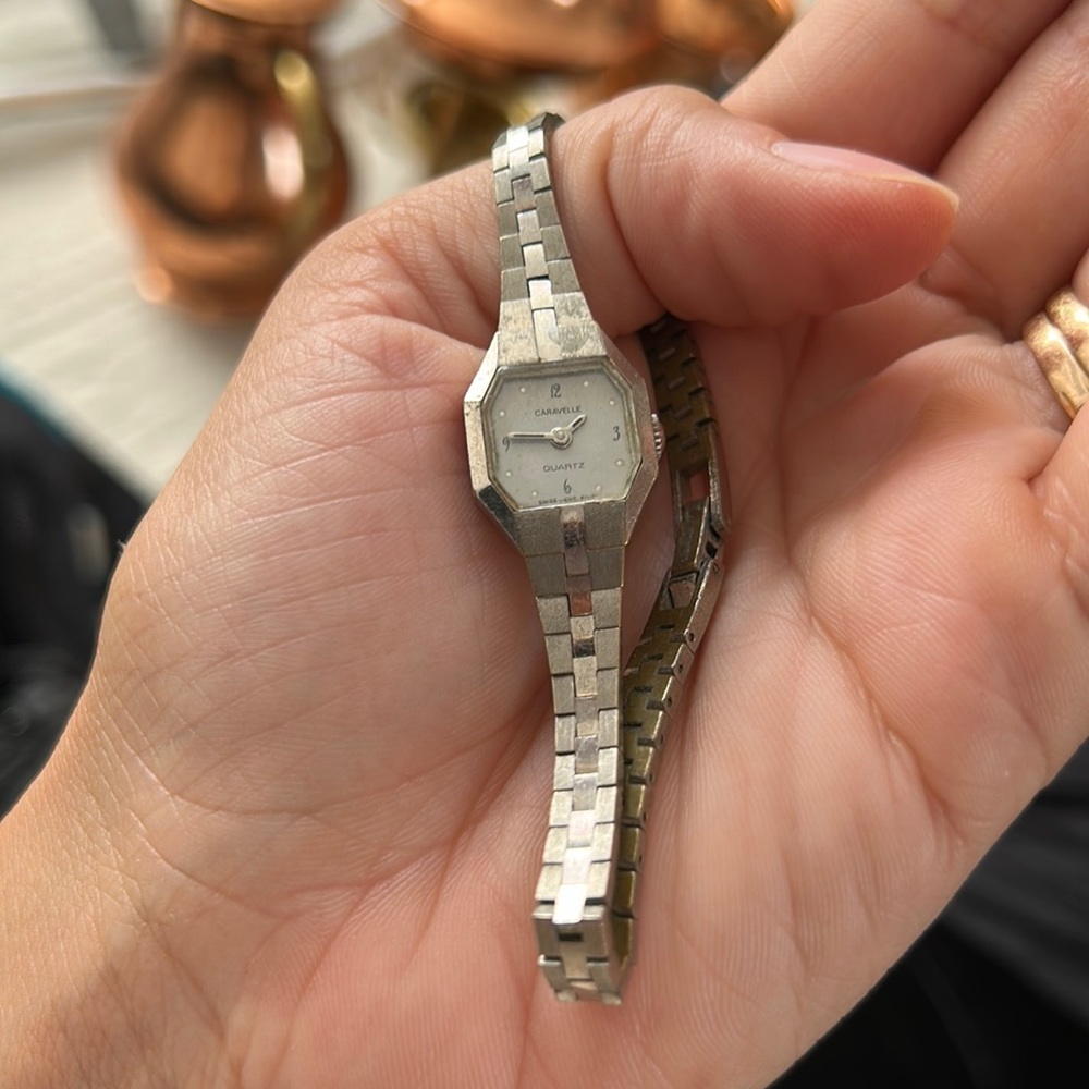 Caravelle Bulova women's dress watch.  Small Octagon face with 3 silver stripes